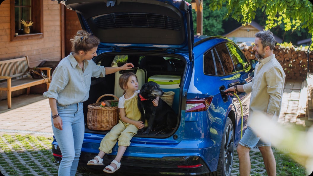 A family loading their EV for a trip